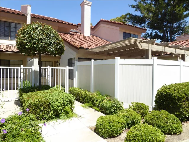 a view of a house with a flower garden