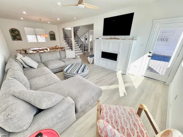 a view of a dining room and hall with furniture