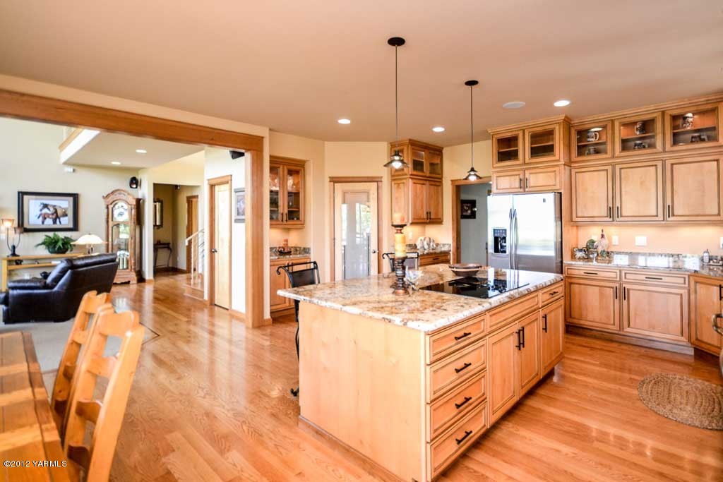6120 South Naches Road Naches, WA 98937 - Photo 8 of 35 a large kitchen with stainless steel appliances kitchen island granite countertop a large cabinets a sink and a counter top space