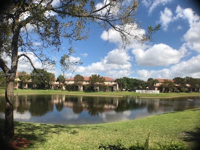 8253 Southwest 29th Street, Unit 104 Miramar, FL 33025 - Photo 4 of 17 a view of a lake with a city
