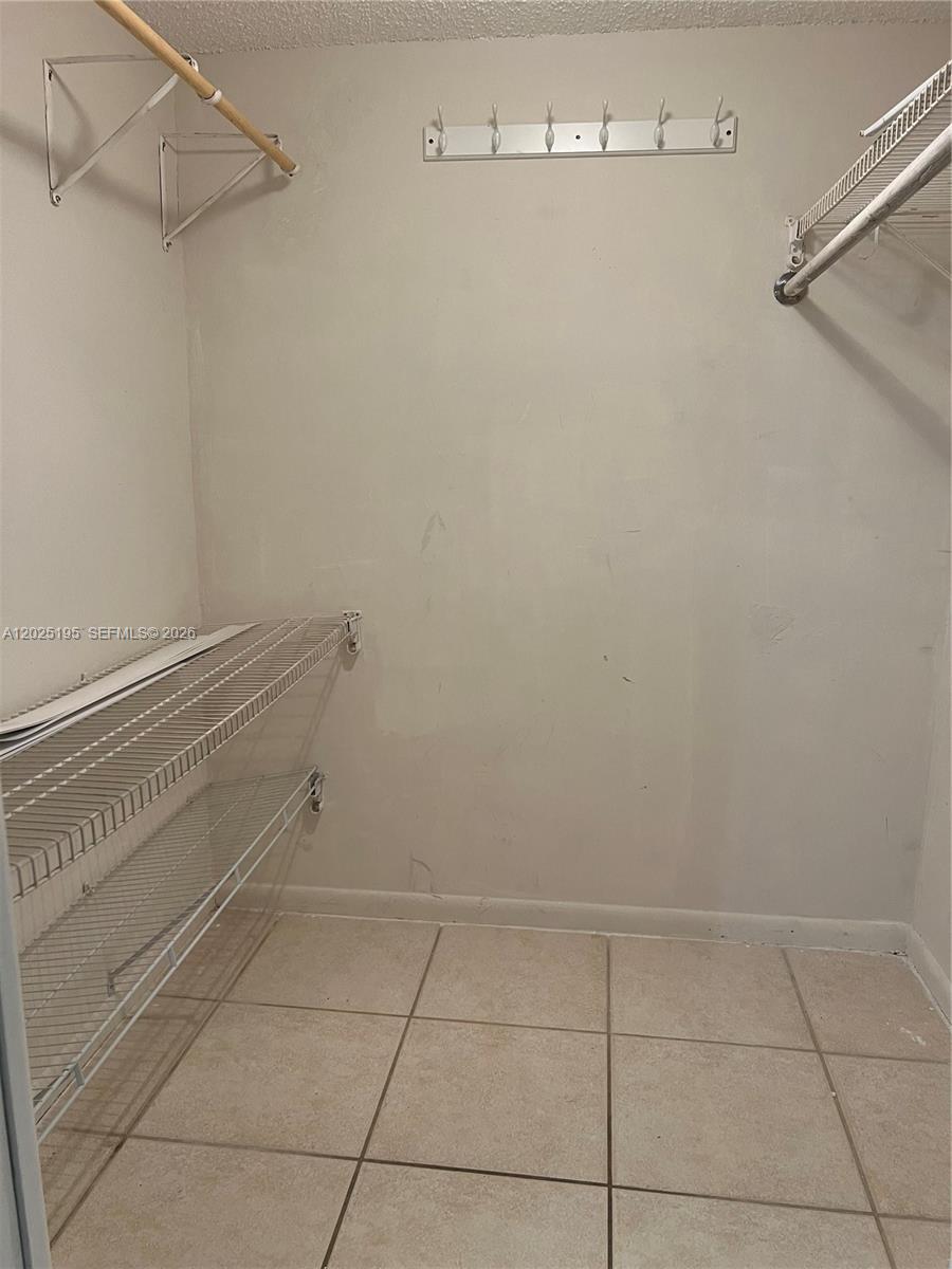 8400 Southwest 133rd Avenue Road, Unit 121 Miami, FL 33183 - Photo 33 of 43 a view of a room with racks on the wall