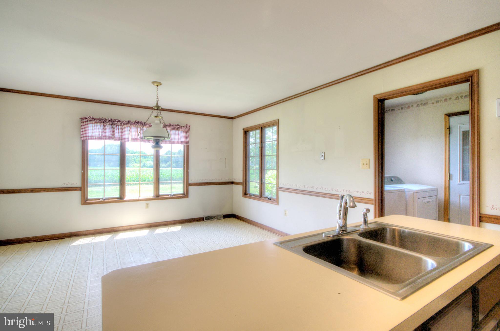 58 Mason Point Road Salem, NJ 08079 - Photo 22 of 41 a kitchen with a sink and a large window