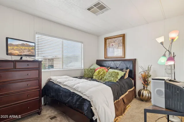 a bedroom with a bed and furniture