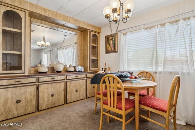 a dining room with furniture and window