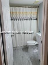 Lakes of Jacaranda Condominiums Plantation, FL 33324 - Photo 12 of 29 a bathroom with a toilet and a shower