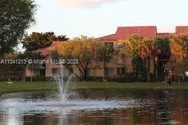 Lakes of Jacaranda Condominiums Plantation, FL 33324 - Photo 19 of 29 a view of a water fountain in front of a house
