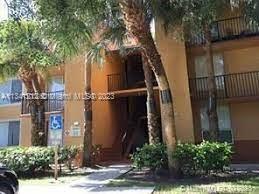 Lakes of Jacaranda Condominiums Plantation, FL 33324 - Photo 20 of 29 a view of street along with trees