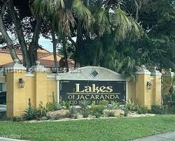 Lakes of Jacaranda Condominiums Plantation, FL 33324 - Photo 23 of 29 a view of a house with a yard and potted plants