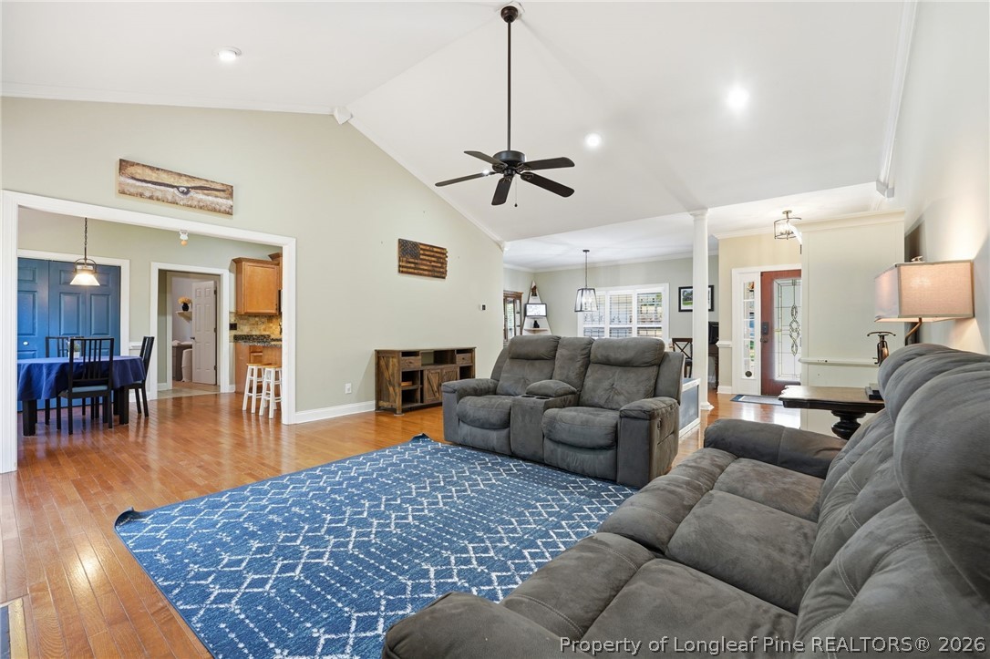 16 Ridge Road Jackson Springs, NC 27281 - Photo 19 of 50 a living room with furniture a dining table and wooden floor
