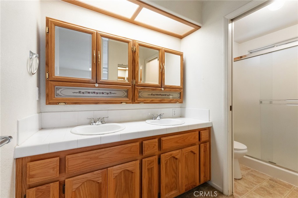 952 Upp Court Hanford, CA 93230 - Photo 22 of 35 a bathroom with a sink and a mirror