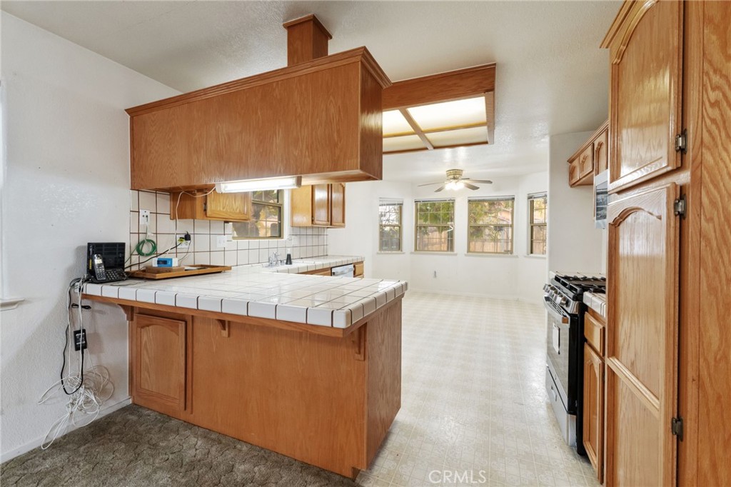952 Upp Court Hanford, CA 93230 - Photo 9 of 35 a utility room with stainless steel appliances granite countertop a sink and a cabinets