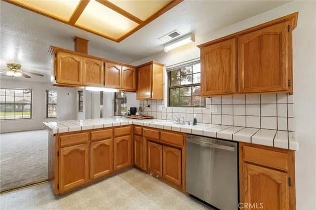 a kitchen with a stove microwave and refrigerator
