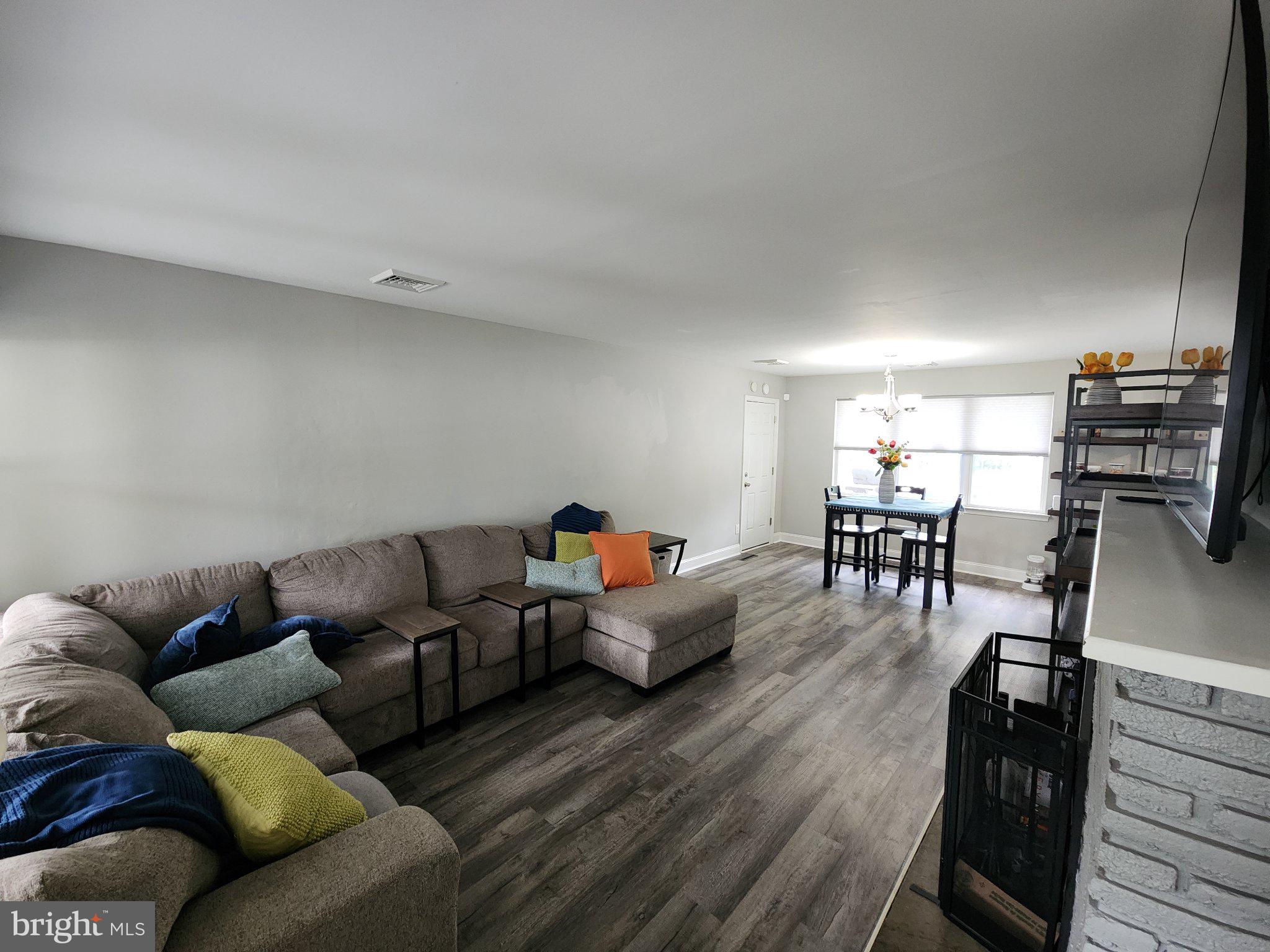 802 Devon Road Riverside, NJ 08075 - Photo 2 of 29 a living room with furniture and a flat screen tv