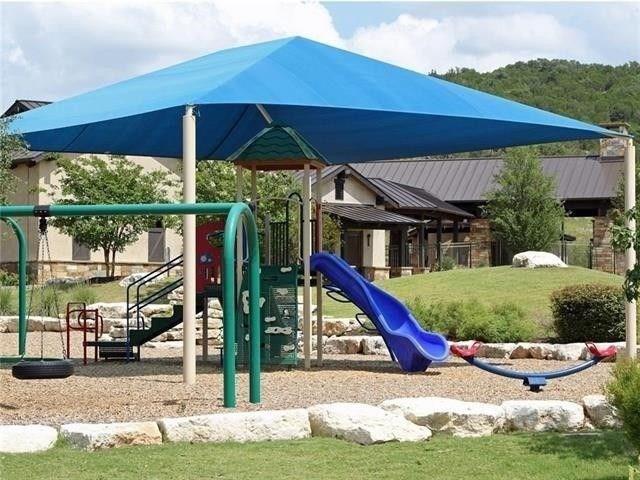 19005 Fernando Trail Austin, TX 78738 - Photo 35 of 35 Community play area featuring a yard
