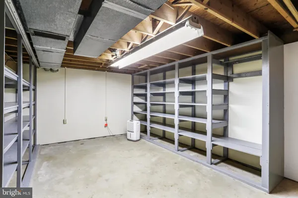 a view of an empty room with a staircase