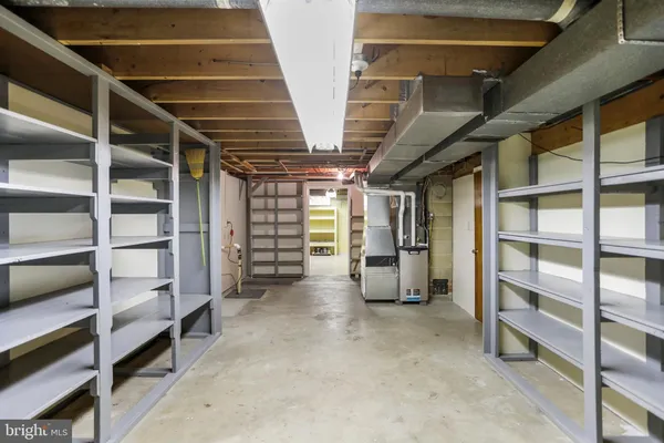 a view of an empty room with furniture