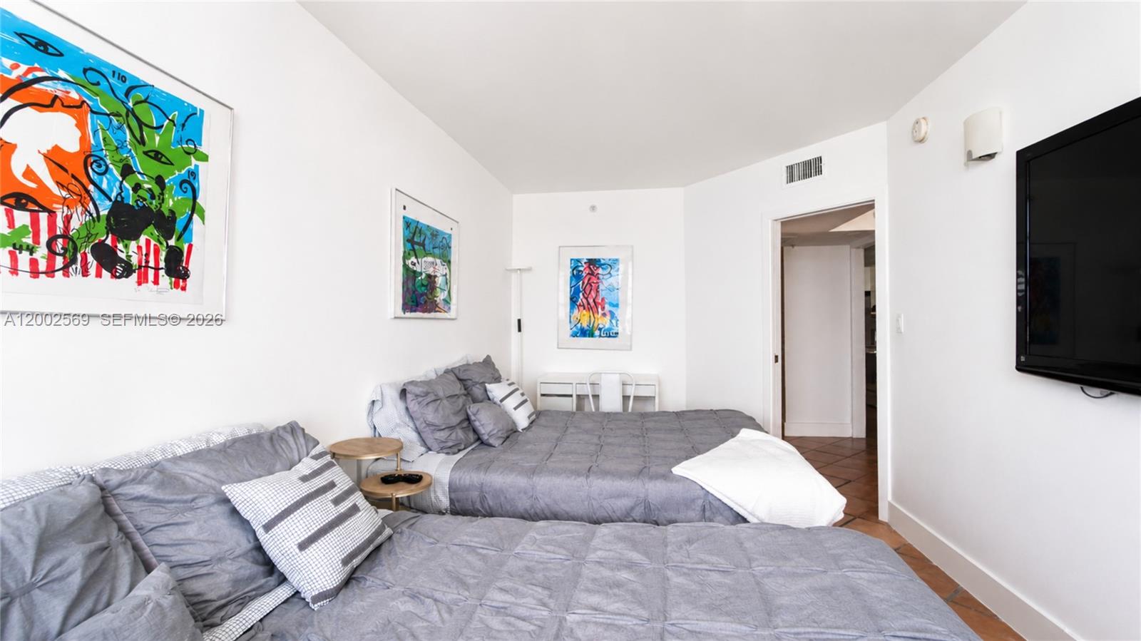 100 Lincoln Road, Unit 1209 Miami Beach, FL 33139 - Photo 10 of 25 a living room with furniture and a flat screen tv