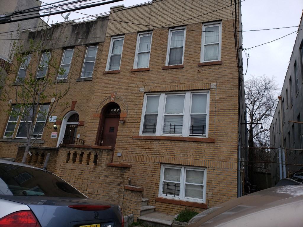 719 East 242nd Street Bronx, NY 10470 - Photo 1 of 1 a front view of a house with a yard