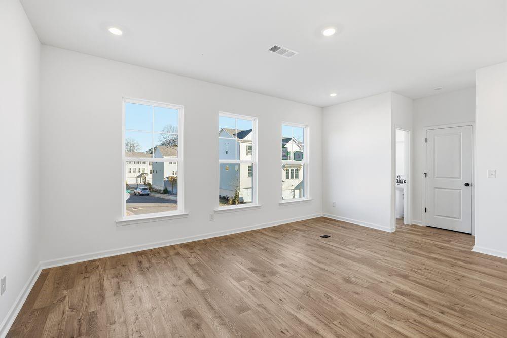 5708 Schelton Place Southeast Mableton, GA 30126 - Photo 13 of 48 an empty room with wooden floor and windows