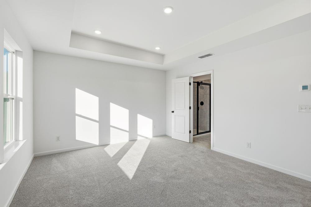 5708 Schelton Place Southeast Mableton, GA 30126 - Photo 18 of 48 an empty room with windows and pillars in it