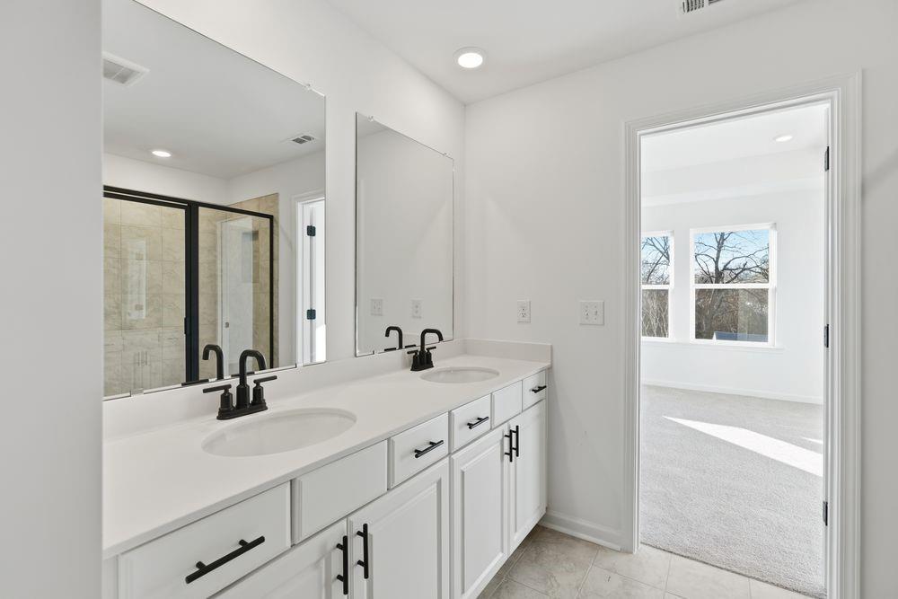 5708 Schelton Place Southeast Mableton, GA 30126 - Photo 20 of 48 a bathroom with 2 sink and a mirror
