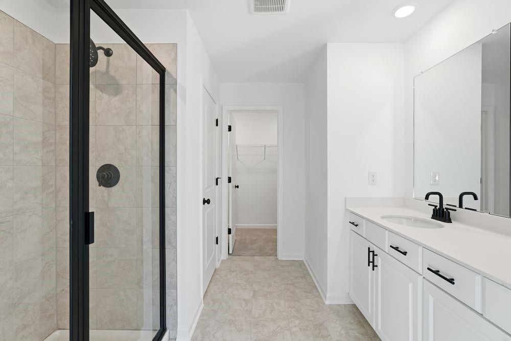 5708 Schelton Place Southeast Mableton, GA 30126 - Photo 21 of 48 a bathroom with a double vanity sink and mirror