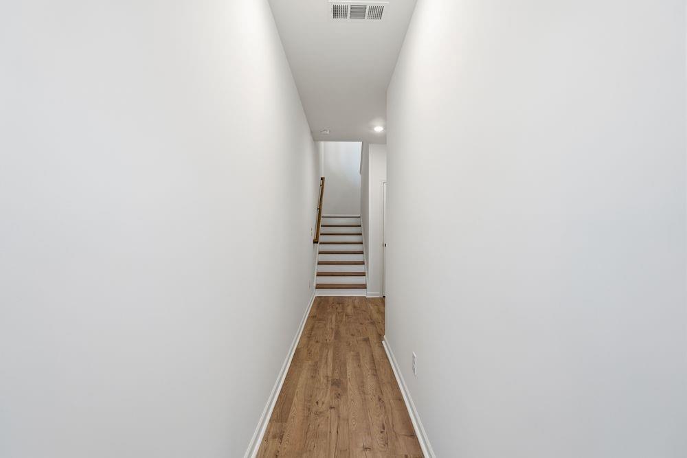 5708 Schelton Place Southeast Mableton, GA 30126 - Photo 34 of 48 a view of a hallway with wooden floor and stairs