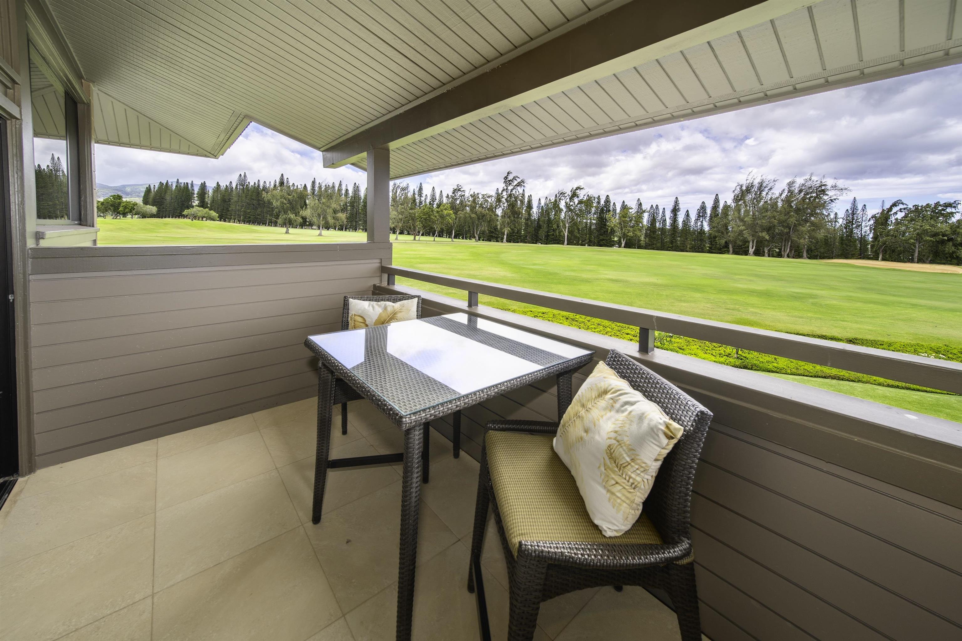 100 Ridge Road, Unit 232324 Lahaina, HI 96761 - Photo 23 of 50 a balcony with table and chairs