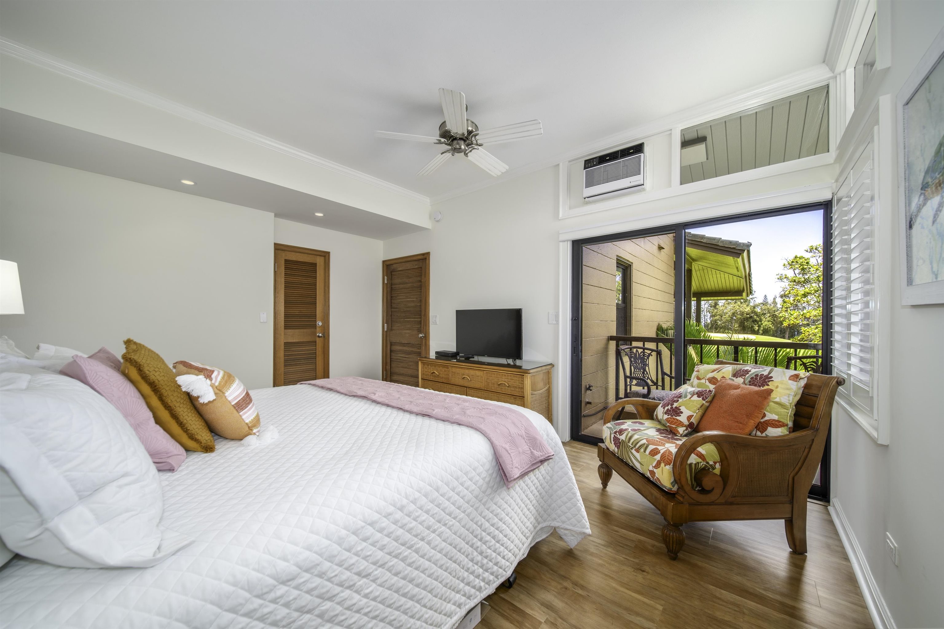 100 Ridge Road, Unit 232324 Lahaina, HI 96761 - Photo 37 of 50 a bedroom with a bed and wooden floor