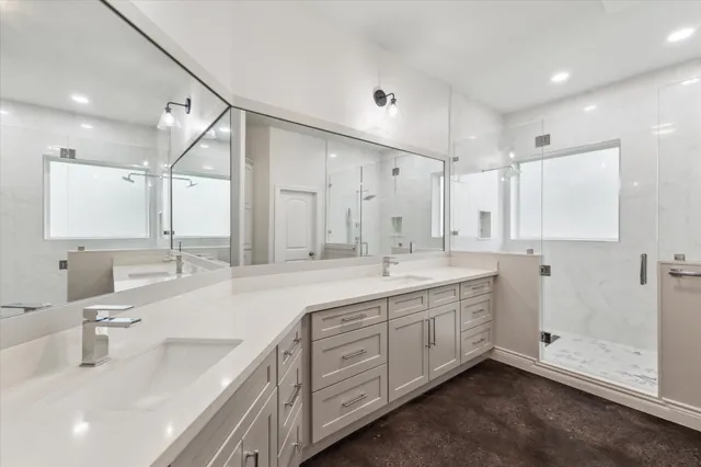a bathroom with a glass shower door