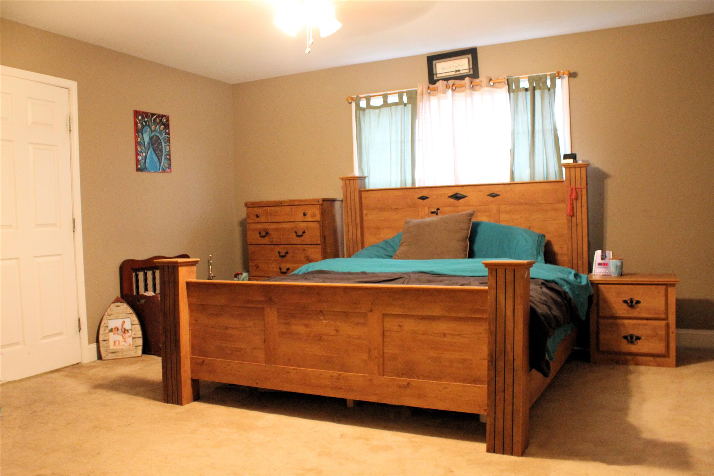 4107 Roy Thompson Road Mount Pleasant, TN 38474 - Photo 5 of 16 The ground floor master bedroom easily accommodates a king-size bed!