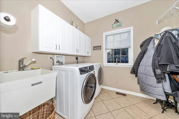 a bathroom with a toilet a sink and a mirror