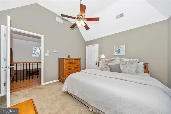 a living room with lots of furniture and a wooden floor