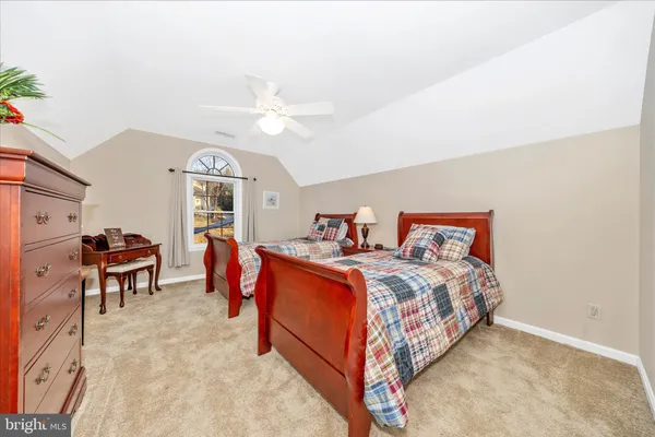 a living room with furniture kitchen view and a window