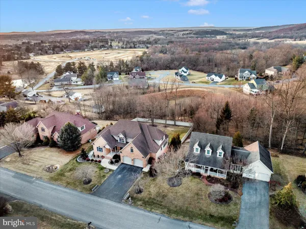 an aerial view of residential building and parking space