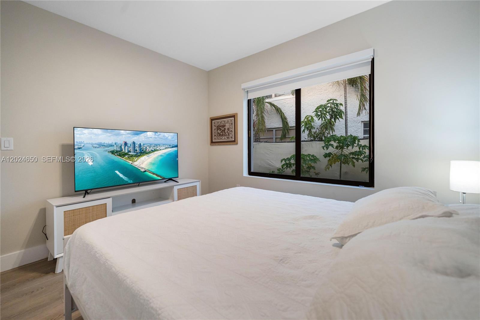 1663 Southwest 13th Street Miami, FL 33145 - Photo 40 of 112 a bedroom with a bed and a flat screen tv