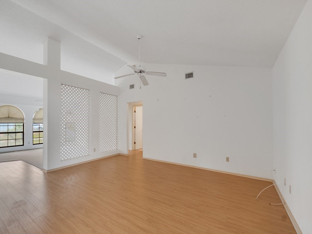 717 Doctor Avenue Sebastian, FL 32958 - Photo 11 of 33 wooden floor in an empty room