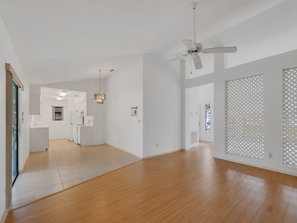 717 Doctor Avenue Sebastian, FL 32958 - Photo 12 of 33 a view of a livingroom with wooden floor and a ceiling fan