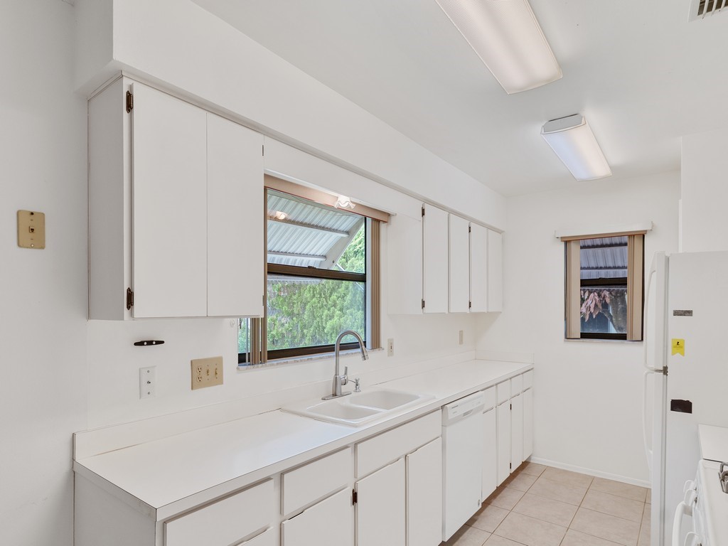 717 Doctor Avenue Sebastian, FL 32958 - Photo 17 of 33 a kitchen with a sink cabinets and window