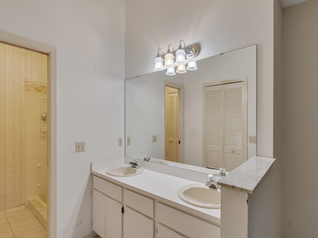 717 Doctor Avenue Sebastian, FL 32958 - Photo 22 of 33 a bathroom with a sink a light fixture and a mirror