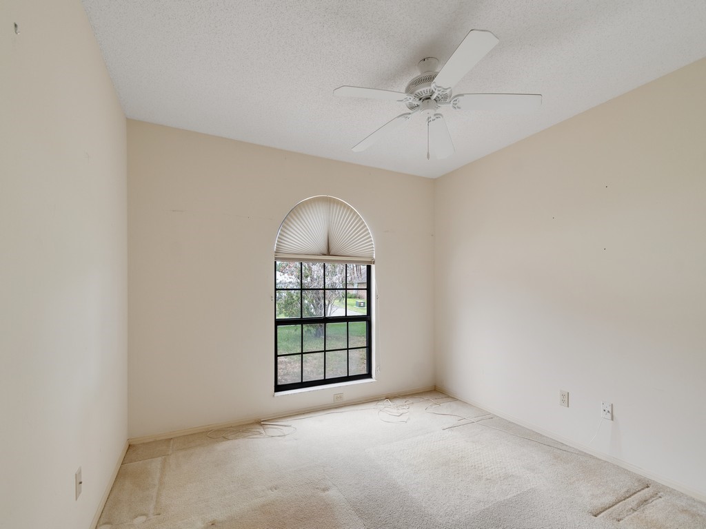 717 Doctor Avenue Sebastian, FL 32958 - Photo 23 of 33 an empty room with windows and fan
