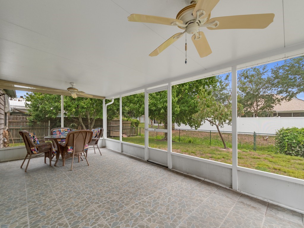 717 Doctor Avenue Sebastian, FL 32958 - Photo 28 of 33 a view of a porch with furniture and a yard