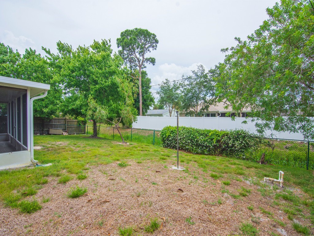 717 Doctor Avenue Sebastian, FL 32958 - Photo 33 of 33 a view of a backyard with large trees