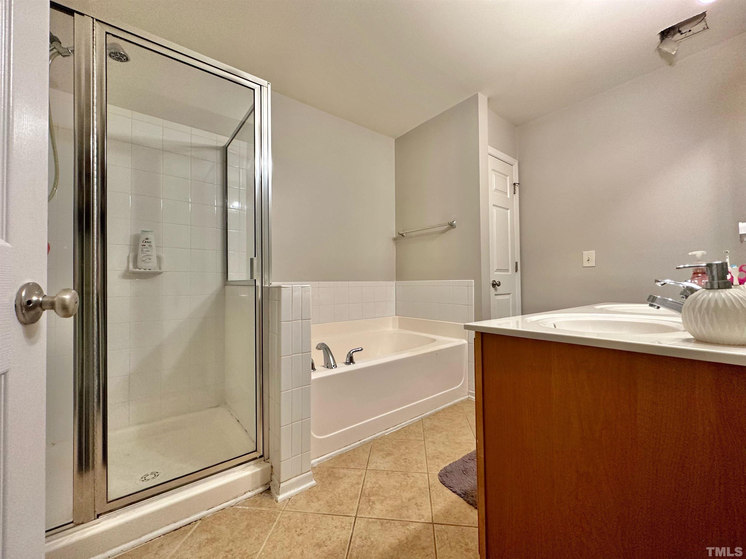330 Gilman Lane, Unit 110 Raleigh, NC 27610 - Photo 13 of 13 a bathroom with a bathtub and a sink