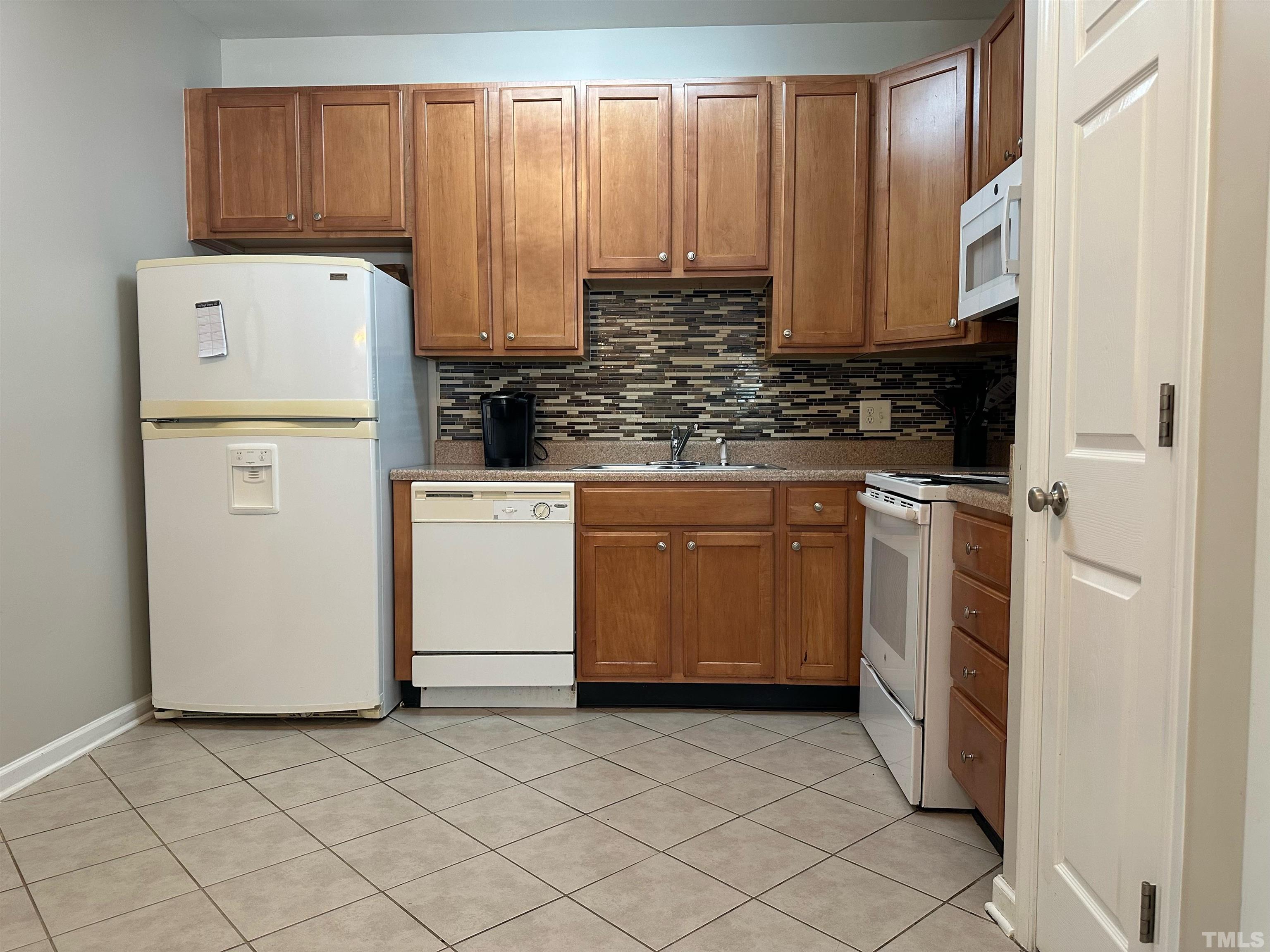 330 Gilman Lane, Unit 110 Raleigh, NC 27610 - Photo 5 of 13 a utility room with dryer and washer
