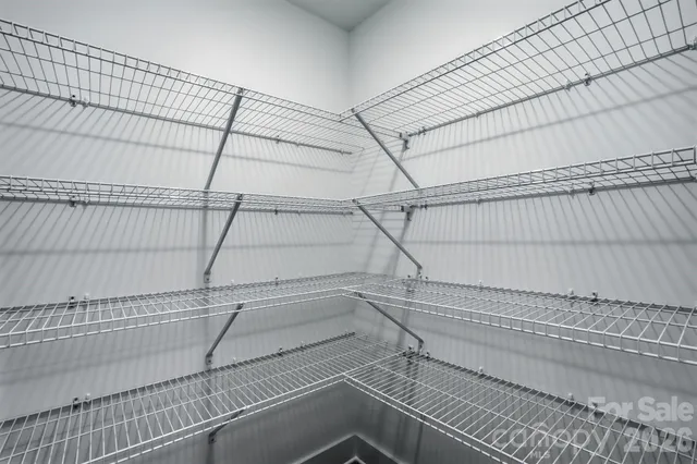 a view of a room with racks on the wall