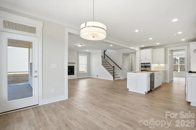 a view of kitchen with cabinets and wooden floor