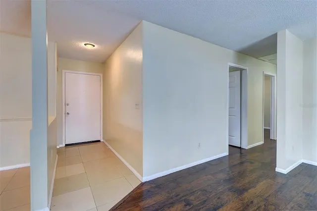 a view of hallway with wooden floor