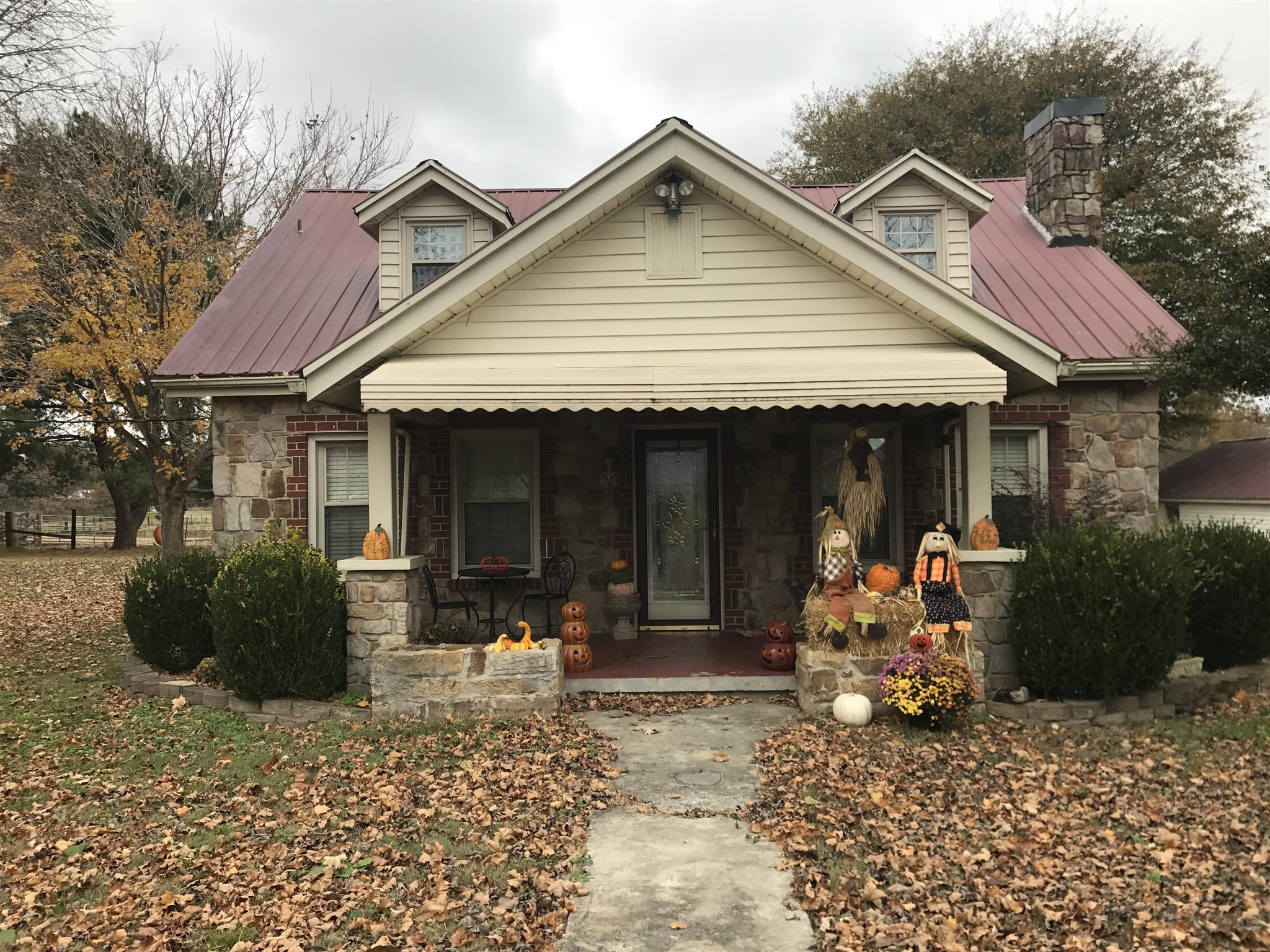 3283 Bells Mill Road Pelham, TN 37366 - Photo 1 of 13 a front view of a house with a sitting area