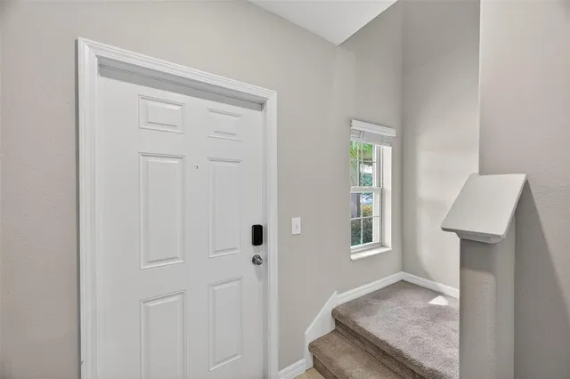 a view of an empty room and fire place